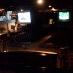 Inside the theatre for w00tstock. They had two screens this time. (There's a balcony area on the left near that screen.)